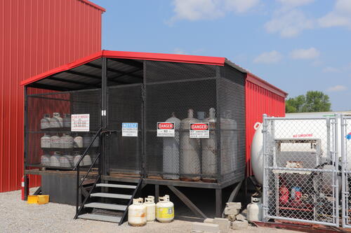 An outdoor shed with propane tanks and cylinders now that Lakes Gas has reopened its Baudette, Minnesota, office
