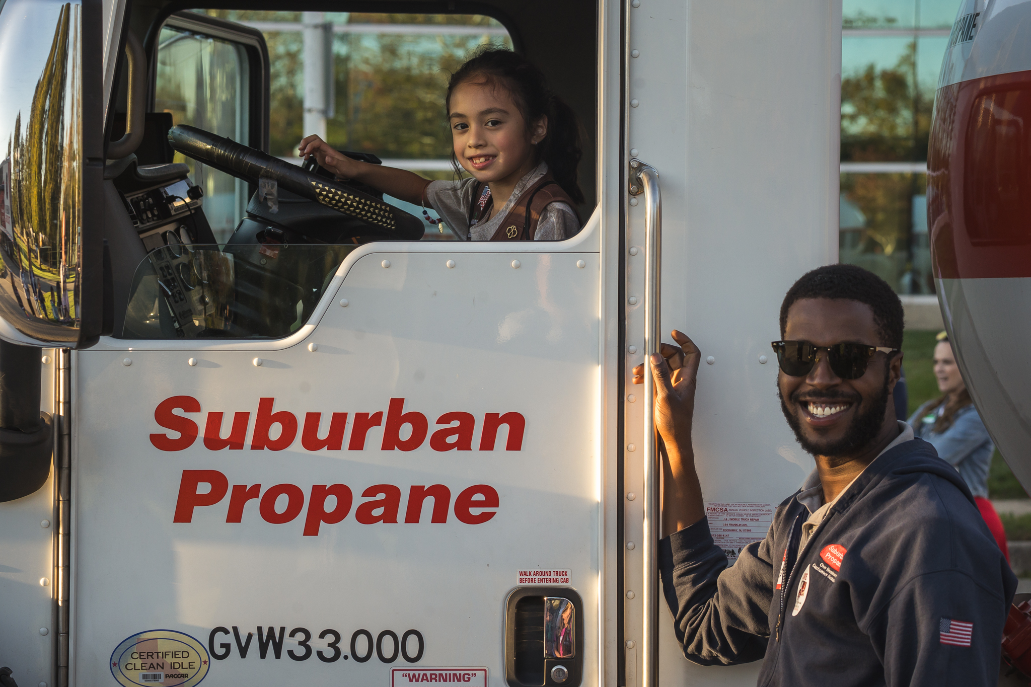 At the Trucks Are for Girls: Fueling the Future event, a Suburban Propane driver shows a girl scout what it's like to sit in the driver's seat of a propane bobtail.
