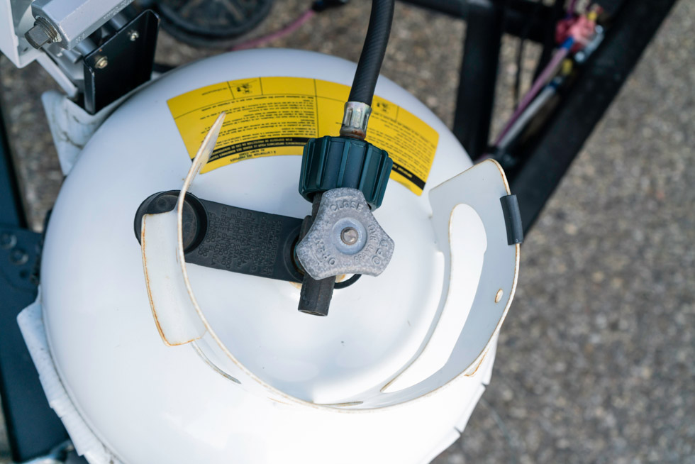 A view from the top of a white propane cylinder hooked up to the back of an RV, representing the 2026 state of the propane industry