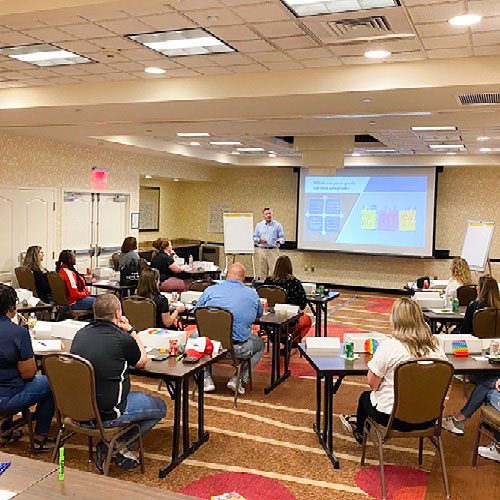 A training expert presents on a screen at a psychological safety session. Photo provided by ThompsonGas.