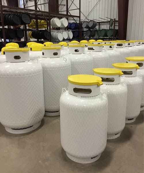Propane cylinders in immaculate condition are displayed as an ideal result of cylinder refurbishment. 