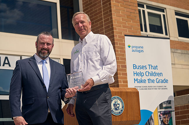Dennis Ryan, coordinator of transportation at North Penn School District (left), accepts the Energy for Everyone Hero Award from Steve Whaley, director of autogas business development at the Propane Education & Research Council (right).