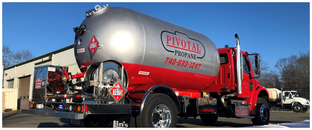 Red and silver Pivotal Propane bobtail truck