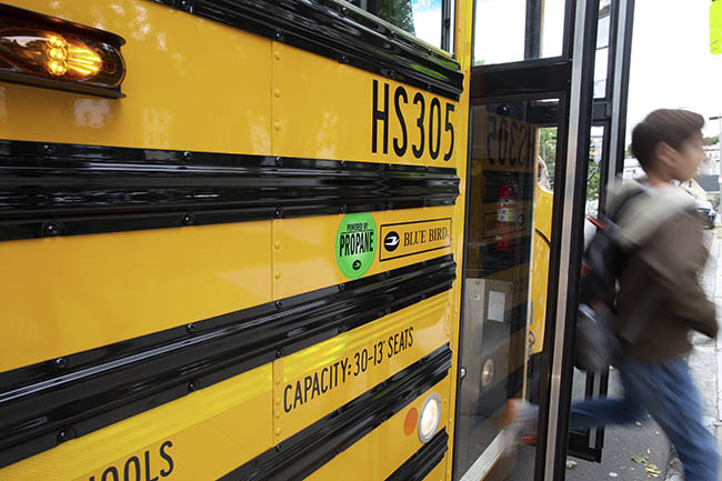 A close-up shot of a school bus is pictured.
