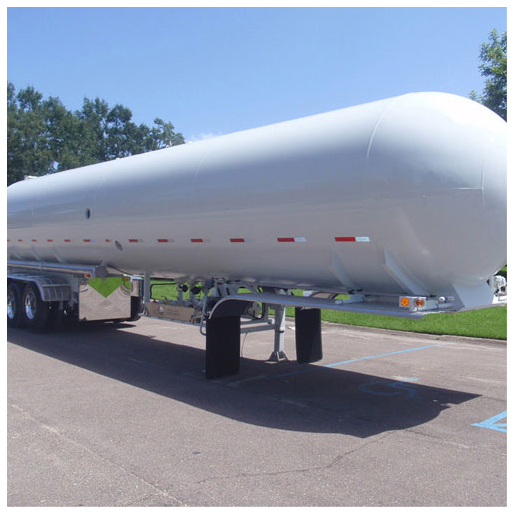 A white propane transport bobtail stands free in a parking lot