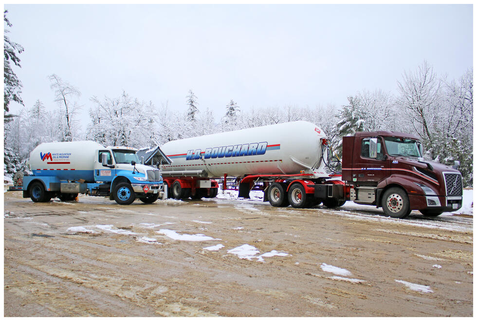 A White Mountain Oil & Propane truck next to another truck