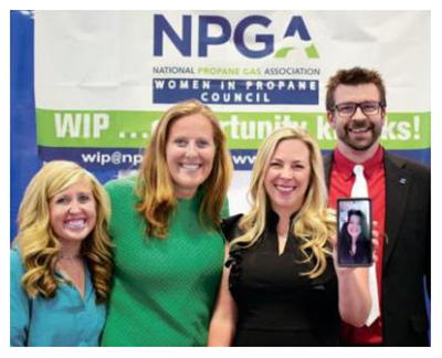 Four people attending NPGA Women in Propane Council conference