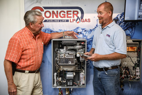 A Conger LP Gas employee demonstrates one of the company systems
