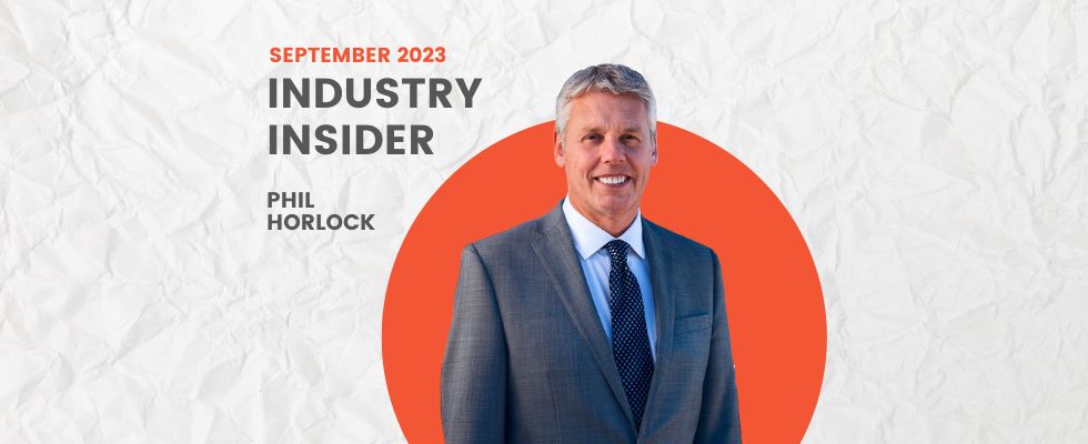 A graphic that says "September 2023 Industry Insider Phil Horlock" with a headshot of Horlock in a dark gray suit in front of an orange circle frame