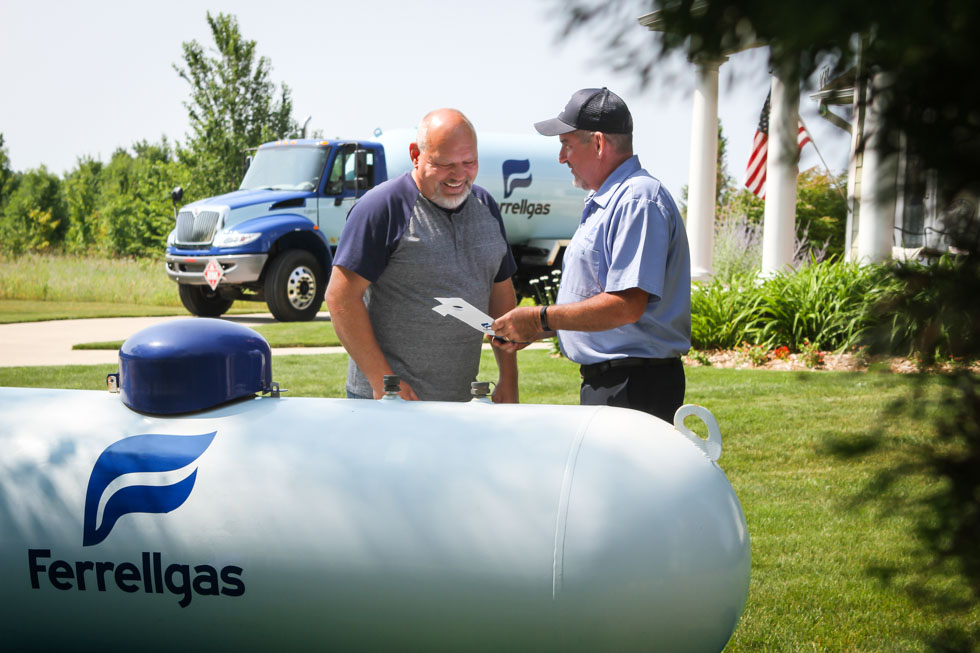 A Ferrellgas employee communicates propane safety to a customer