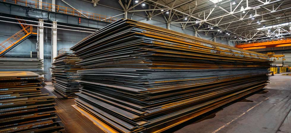 Stacks of steel sheets in a warehouse