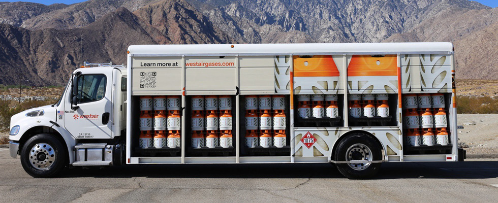 A Westair truck is filled with propane cylinders.