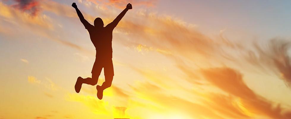 This image is an example of someone jumping for joy due to joy-focused propane management