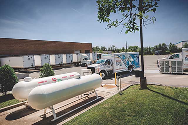 Propane autogas tanks are featured with a propane autogas fleet in the background.