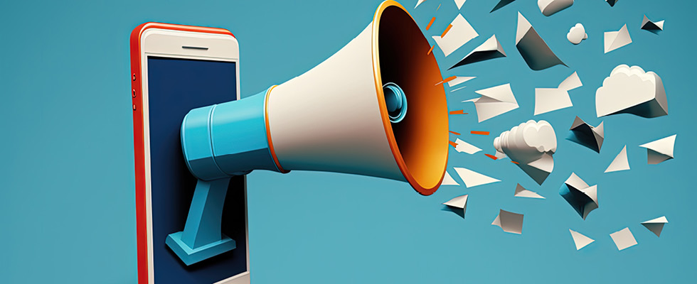 An illustration of a megaphone coming out of the screen of a smart phone, with paper pieces and clouds bursting out of the megaphone