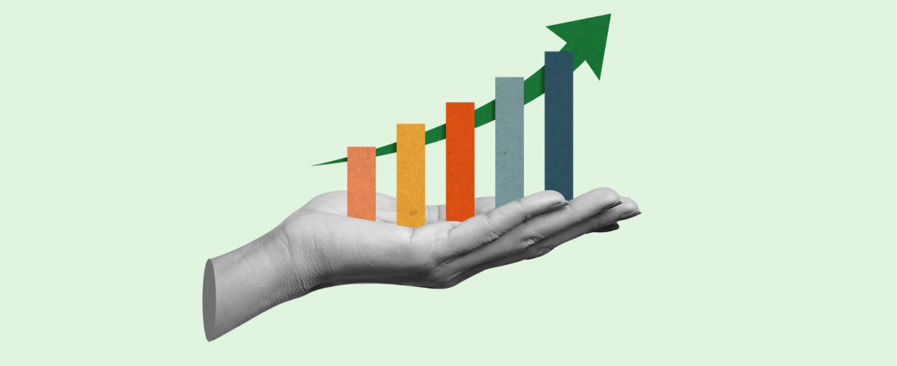 A graphic depicts a hand holding a chart showing upward growth.