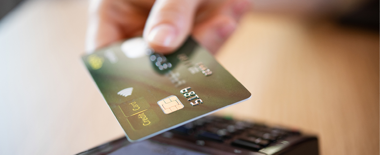 Payment processing strategy is represented by a photo of a customer using a card.