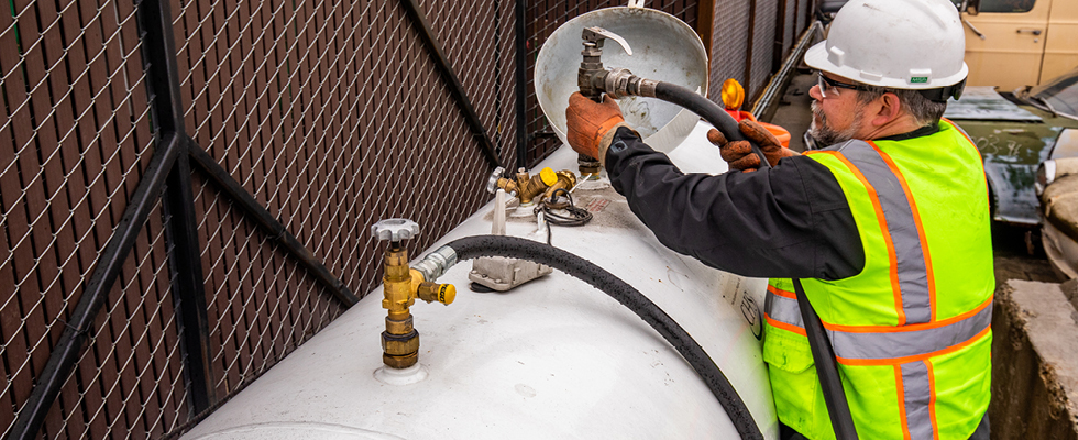 Workers practicing proactive propane maintenance
