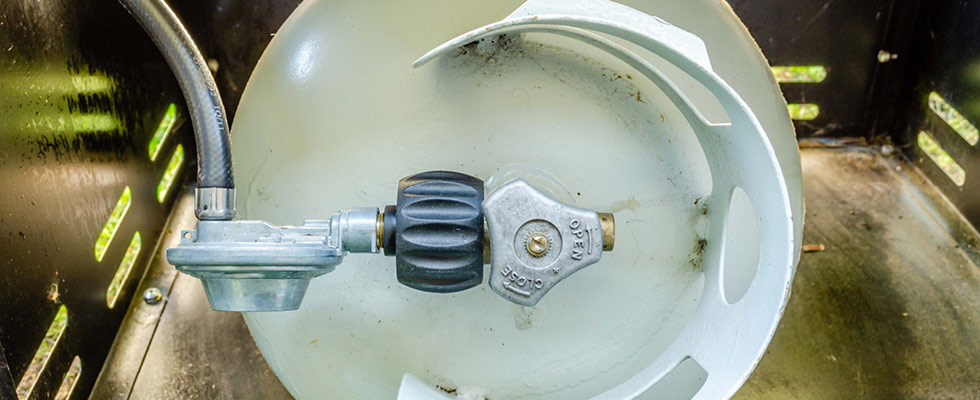 Pictured is a propane regulator hose, essential to prevent a propane grill explosion