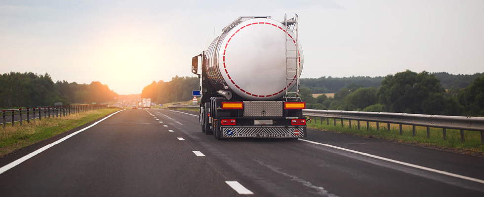 A propane truck driving on a highway