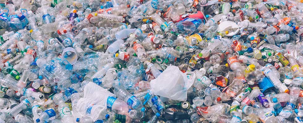 Piles of plastic and plastic water bottle waste