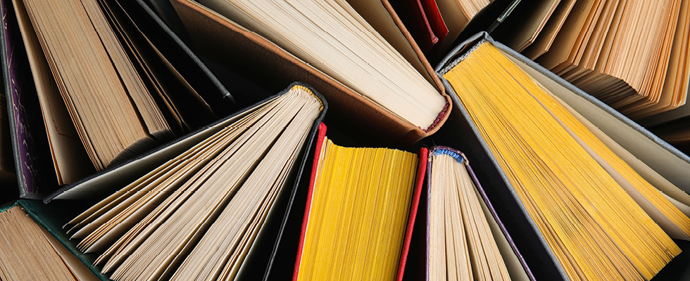 An image shows various books, emphasizing this month's Verbatim column question.