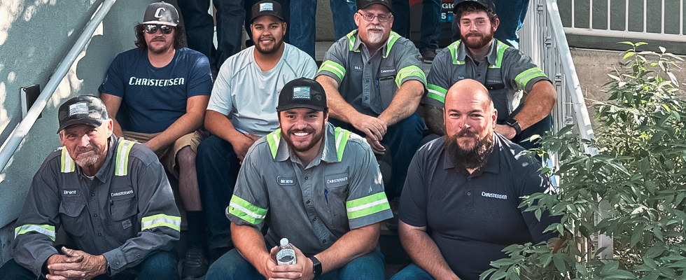 Members of the Christensen team are pictured in their work gear.