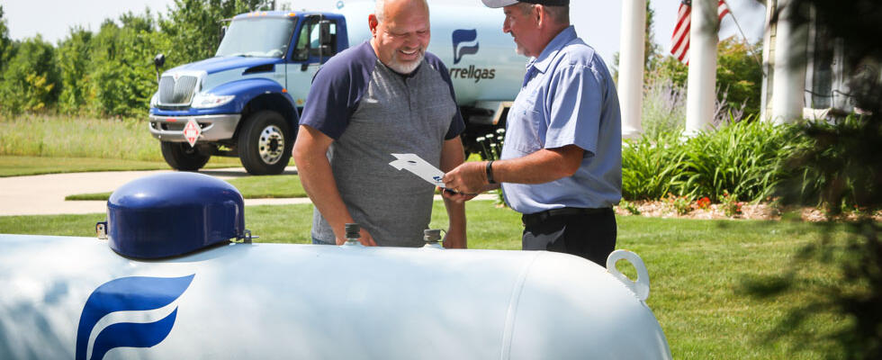 A Ferrellgas employee communicates propane safety to a customer