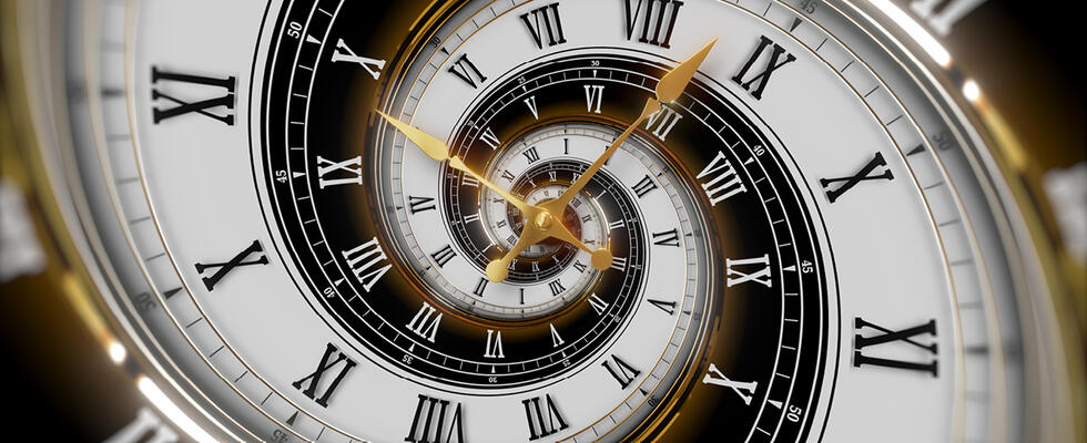 A clock is featured, showcasing the topic of time travel in this month's Verbatim