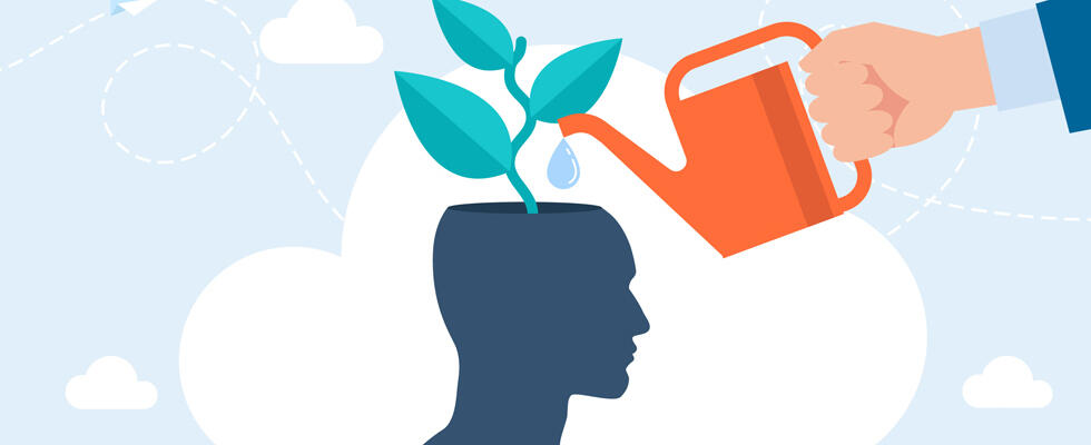 A hand using a watering can to water a brain just like unexpected lessons learned this past year