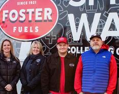 Representatives from Foster Fuels are pictured in front of their community service truck.