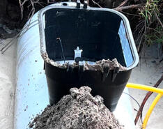 An underground propane tank is pictured as it is being maintenanced.