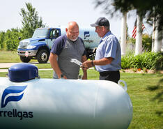 A Ferrellgas employee communicates propane safety to a customer