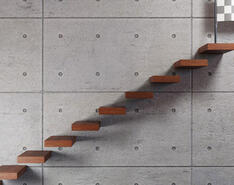 A graphic depicts a figure about to go up steps to a finish mark.