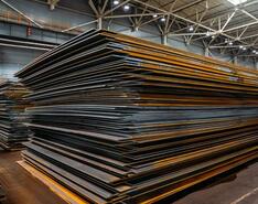 Stacks of steel sheets in a warehouse