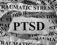 A picture features word clippings around the topic of "PTSD."