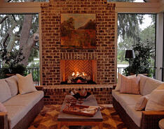 The Southern Living Idea House's living room fireplace is pictured.