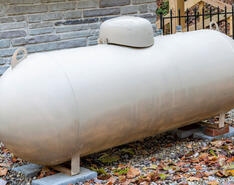 An image of a propane tank is featured, showcasing the importance of propane tank placement.