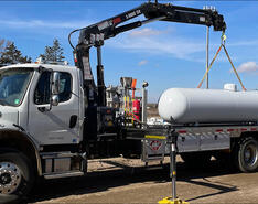 A truck loading a propane tank