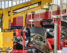 An assembly line of cars fine-tuned to run on propane autogas.