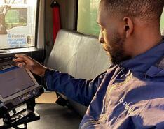 A Paraco Gas employee uses the company's digital customer relationship management software installed in the cab of a truck.