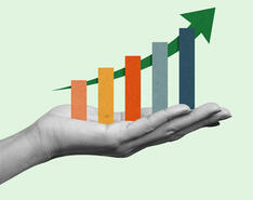 A graphic depicts a hand holding a chart showing upward growth.