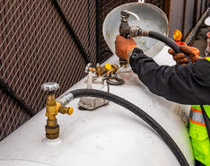 Workers practicing proactive propane maintenance
