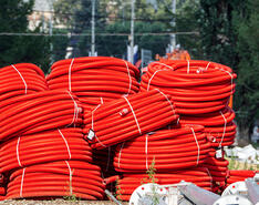 An image of PEX-AL-PEX piping is featured outdoors.