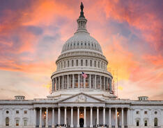 A picture of the capitol building and the sunset behind it, where Propane Days takes place.