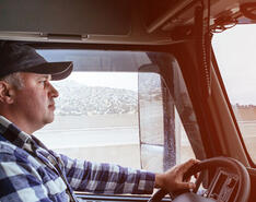 A man driving a truck