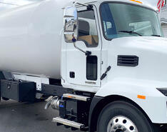 An IPS bobtail truck is featured.