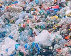Piles of plastic and plastic water bottle waste