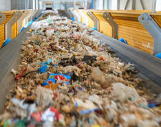 Trash on a conveyor belt on its way to the next part of recycling