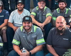 Members of the Christensen team are pictured in their work gear.